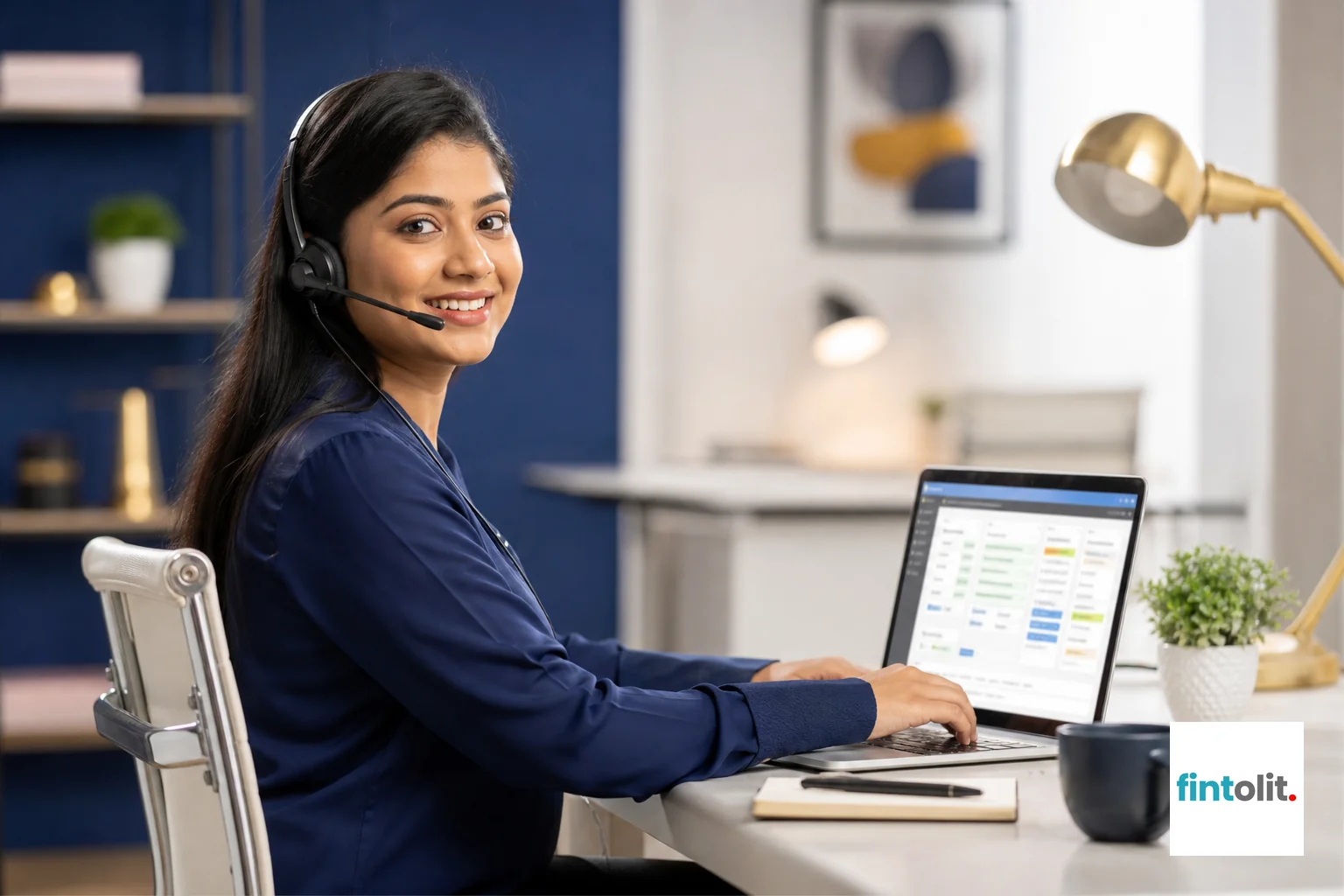 photorealistic photo of a professional Indian woman in her late 20s working as a case coordinator, sitting at a clean modern desk with a headset on, smiling warmly while talking on a call, laptop screen showing a case tracking dashboard