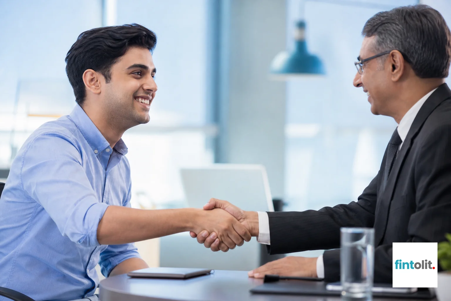 Close-up of a founder shaking hands with a verified lawyer after a consultation, symbolizing trust and verification. photorealistic, close-up medium shot of a confident handshake between a young Indian startup founder and a senior corporate