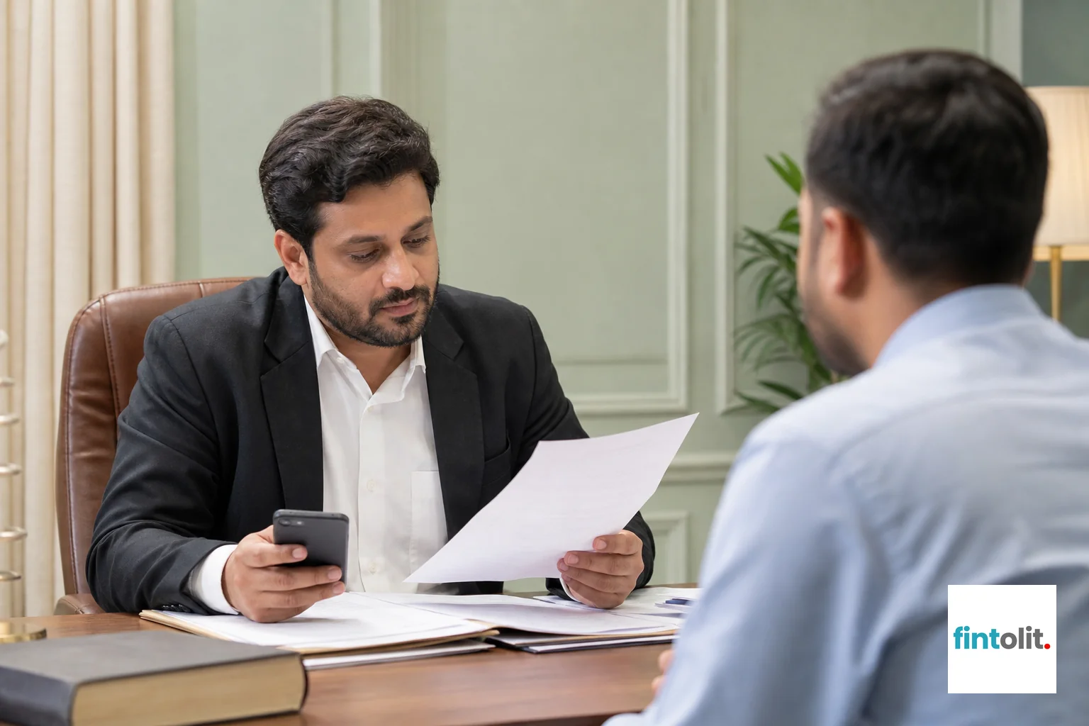 Consultation between a client and a lawyer discussing documents, evidence organized on table. Photorealistic photograph of an Indian lawyer in business casual attire sitting across a table from a client, reviewing printed documents and a